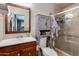 Clean bathroom with a shower, toilet, and vanity with storage at 7830 N 17Th Ave, Phoenix, AZ 85021