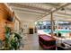 Relaxing patio with pool view, seating area, and covered structure at 7830 N 17Th Ave, Phoenix, AZ 85021