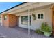 Inviting front porch with brick columns and charming decor at 7830 N 17Th Ave, Phoenix, AZ 85021