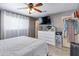 Spacious bedroom with a dresser, large TV, and ample closet space at 7830 N 17Th Ave, Phoenix, AZ 85021