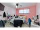 Bedroom with a full-sized bed, desk, and built-in storage at 7830 N 17Th Ave, Phoenix, AZ 85021