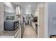 Eat-in kitchen with granite countertops and stainless steel appliances at 7830 N 17Th Ave, Phoenix, AZ 85021