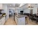 Open concept kitchen with island, granite countertops, and stainless steel appliances at 7830 N 17Th Ave, Phoenix, AZ 85021