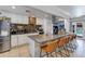 Bright kitchen with granite countertops, island, and stainless steel appliances at 7830 N 17Th Ave, Phoenix, AZ 85021