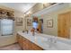 Bathroom with double vanity, large mirror, and decorative wall art at 38332 N 25Th Ave, Phoenix, AZ 85086