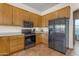 Modern kitchen with stainless steel appliances and light wood cabinets at 38332 N 25Th Ave, Phoenix, AZ 85086