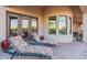 Relaxing patio with lounge chairs and brick pavers at 6762 W Hombre Rd, San Tan Valley, AZ 85144