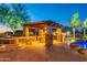 Outdoor kitchen with pergola, grill, and stone countertops at 6762 W Hombre Rd, San Tan Valley, AZ 85144