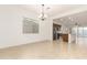 Bright dining room with tile floors and an open view to the kitchen at 13618 W Shifting Sands Dr, Peoria, AZ 85383