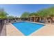 Community pool with a covered seating area at 854 S San Marcos Dr Bldg 1 Dr # A, Apache Junction, AZ 85120