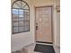 Inviting condo entryway with a neutral-toned door at 930 N Mesa Dr # 1003, Mesa, AZ 85201