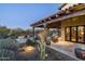 Relaxing covered patio with comfortable seating and fire pit at 8212 E Tortuga View Ln, Scottsdale, AZ 85266