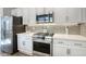 Modern kitchen with stainless steel appliances at 14231 W Bronco Trl, Surprise, AZ 85387