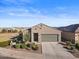 Single-story home with a two-car garage at 42165 W Sunflower Rd, Maricopa, AZ 85138