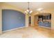 Dining room with tile flooring and view into the kitchen at 29104 N 124Th Dr, Peoria, AZ 85383