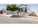Mobile home with carport and landscaping at 7750 E Broadway Rd # 277, Mesa, AZ 85208
