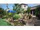 Community clubhouse with a waterfall and putting green at 7750 E Broadway Rd # 277, Mesa, AZ 85208