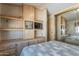 Main bedroom with built-in shelving and a mirrored closet at 7750 E Broadway Rd # 277, Mesa, AZ 85208