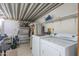 Laundry room with washer, dryer, and ample storage shelving at 7750 E Broadway Rd # 277, Mesa, AZ 85208
