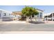 Mobile home exterior with carport and landscaping at 7750 E Broadway Rd # 277, Mesa, AZ 85208