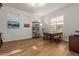 Home office with hardwood floors and built-in shelving at 29851 N 78Th Way, Scottsdale, AZ 85266