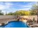 Spacious kidney-shaped pool with waterfall feature at 29851 N 78Th Way, Scottsdale, AZ 85266