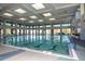 Indoor lap pool with multiple lanes and large windows at 17041 W Artesia Dr, Surprise, AZ 85387