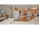 Eat-in kitchen with island and adjacent dining area at 17041 W Artesia Dr, Surprise, AZ 85387