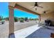 Covered patio with seating area and view of backyard at 17041 W Artesia Dr, Surprise, AZ 85387