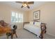 Guest bedroom with daybed and window shutters at 17041 W Artesia Dr, Surprise, AZ 85387