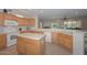 Spacious kitchen with island, ample cabinetry, and modern appliances at 17041 W Artesia Dr, Surprise, AZ 85387