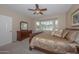 Guest bedroom with two twin beds, dresser, and plenty of natural light at 17041 W Artesia Dr, Surprise, AZ 85387