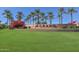 Community entrance with 'The Grand' signage and landscaping at 17041 W Artesia Dr, Surprise, AZ 85387