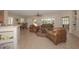 Spacious living room with leather furniture and fireplace at 17041 W Artesia Dr, Surprise, AZ 85387