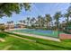 Community tennis court with lush landscaping at 17041 W Artesia Dr, Surprise, AZ 85387