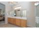 Double vanity bathroom with a large mirror and plenty of storage at 17041 W Artesia Dr, Surprise, AZ 85387