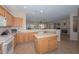 Open kitchen features a large island and a breakfast bar at 17041 W Artesia Dr, Surprise, AZ 85387
