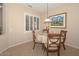 Charming dining area with table and chairs near kitchen at 17041 W Artesia Dr, Surprise, AZ 85387