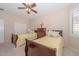 Guest bedroom with two twin beds and a dresser at 17041 W Artesia Dr, Surprise, AZ 85387