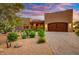 Beautiful home exterior with wooden garage doors and desert landscaping at 26401 N Trails End --, Rio Verde, AZ 85263