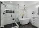 Elegant bathroom with a freestanding tub, walk-in shower, and stylish chandelier at 3353 E Blue Ridge Way, Gilbert, AZ 85298