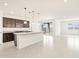 Modern kitchen with island and stainless steel appliances at 37232 W Patterson St, Maricopa, AZ 85138