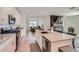 Modern kitchen with an island, stainless steel appliances, and white cabinets at 3103 E Hayfield Way, San Tan Valley, AZ 85140