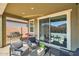Relaxing covered patio with seating and a built-in grill at 3103 E Hayfield Way, San Tan Valley, AZ 85140