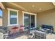 Covered patio with seating, a small table, and a grill at 3103 E Hayfield Way, San Tan Valley, AZ 85140
