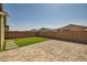 Artificial turf backyard with a paved patio area at 3103 E Hayfield Way, San Tan Valley, AZ 85140