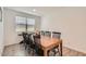 Dining room with a large wooden table and black chairs at 3103 E Hayfield Way, San Tan Valley, AZ 85140