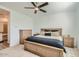 Main bedroom with a large bed, dresser, and ceiling fan at 3103 E Hayfield Way, San Tan Valley, AZ 85140