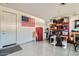 Garage with storage shelving and a red refrigerator at 3103 E Hayfield Way, San Tan Valley, AZ 85140