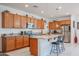 Kitchen boasts granite countertops and wood cabinets at 8344 S 165Th Dr, Goodyear, AZ 85338